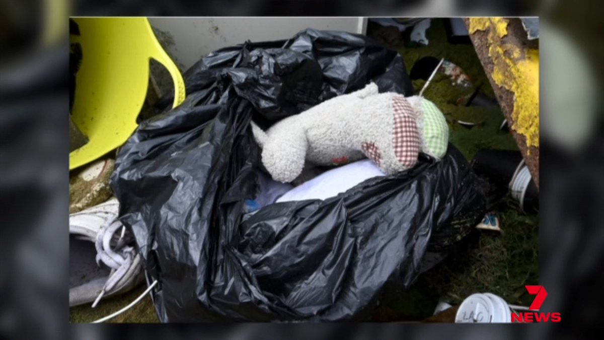 A news photo from '7NEWS' shows a stuffed teddy bear and other discarded items in a black garbage bag on the ground.