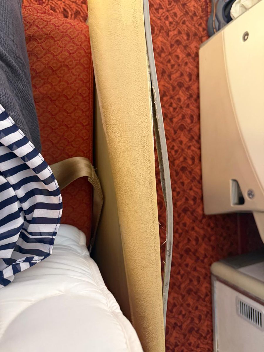 HarjinderTalwar's tweet photo. Paid for Business Class on @airindia AI-153 to Vienna. Allotted 3B, tagged "INOP" with a broken panel, and it won't recline. Check-in said nothing was wrong. On board, I was told to sit in it for a long-haul flight or move. I'm now in economy.
 @PMOIndia @MoCA_GoI @DGCAIndia @TataCompanies