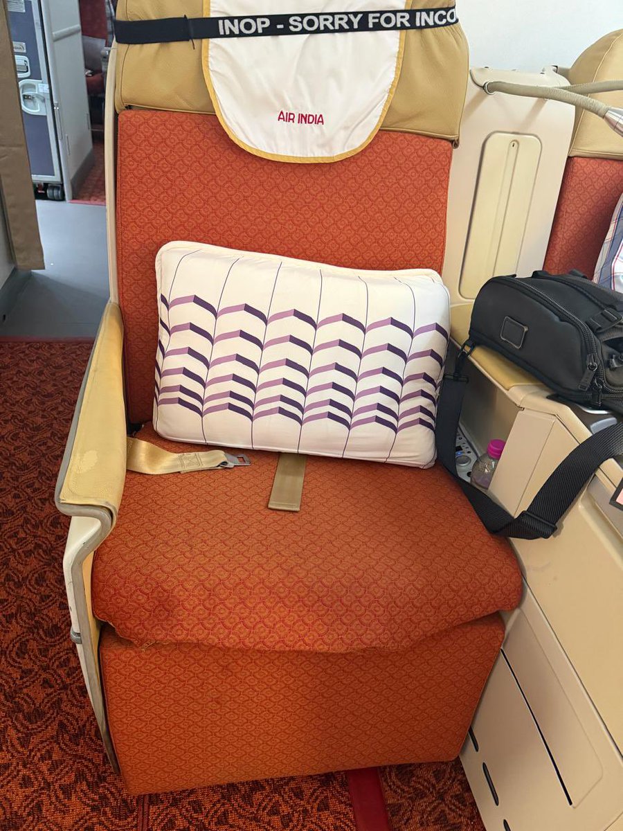 HarjinderTalwar's tweet photo. Paid for Business Class on @airindia AI-153 to Vienna. Allotted 3B, tagged "INOP" with a broken panel, and it won't recline. Check-in said nothing was wrong. On board, I was told to sit in it for a long-haul flight or move. I'm now in economy.
 @PMOIndia @MoCA_GoI @DGCAIndia @TataCompanies