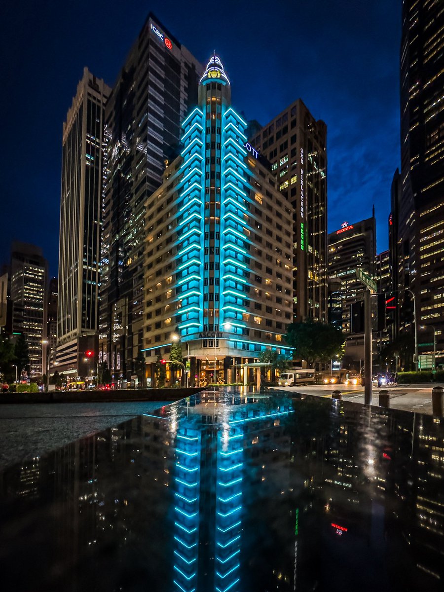 javanng's tweet photo. Feeling blue (in the best way possible)! Catching the neon blue glow of Ascott Raffles Place against the CBD high-rises.

#loves_reflections #singapore #citybynight #architecture_view #nightphotography https://t.co/W05pJQ4c2n