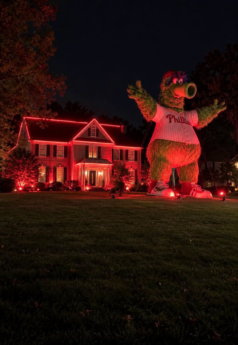 Mrstanleycup's tweet photo. BREAKING: Delco house goes all out for Red October. Never mind the red lighting. This house in Upper Providence has an enormous Phanatic on display like it’s about to come to life and go on a rampage through town.

This thing needs to be put in a museum. Imagine looking out your bedroom window and making eye contact with this thing at 2 a.m. Hopefully their neighbors aren’t Karens.

In Delco, the bigger the display in your front yard, the more respect you have in your town. Forget about giant oversized lawn skeletons this year. This guy just one-upped every one of them with a Godzilla-size Phanatic.

@BobKellyFOX29  @MrUram