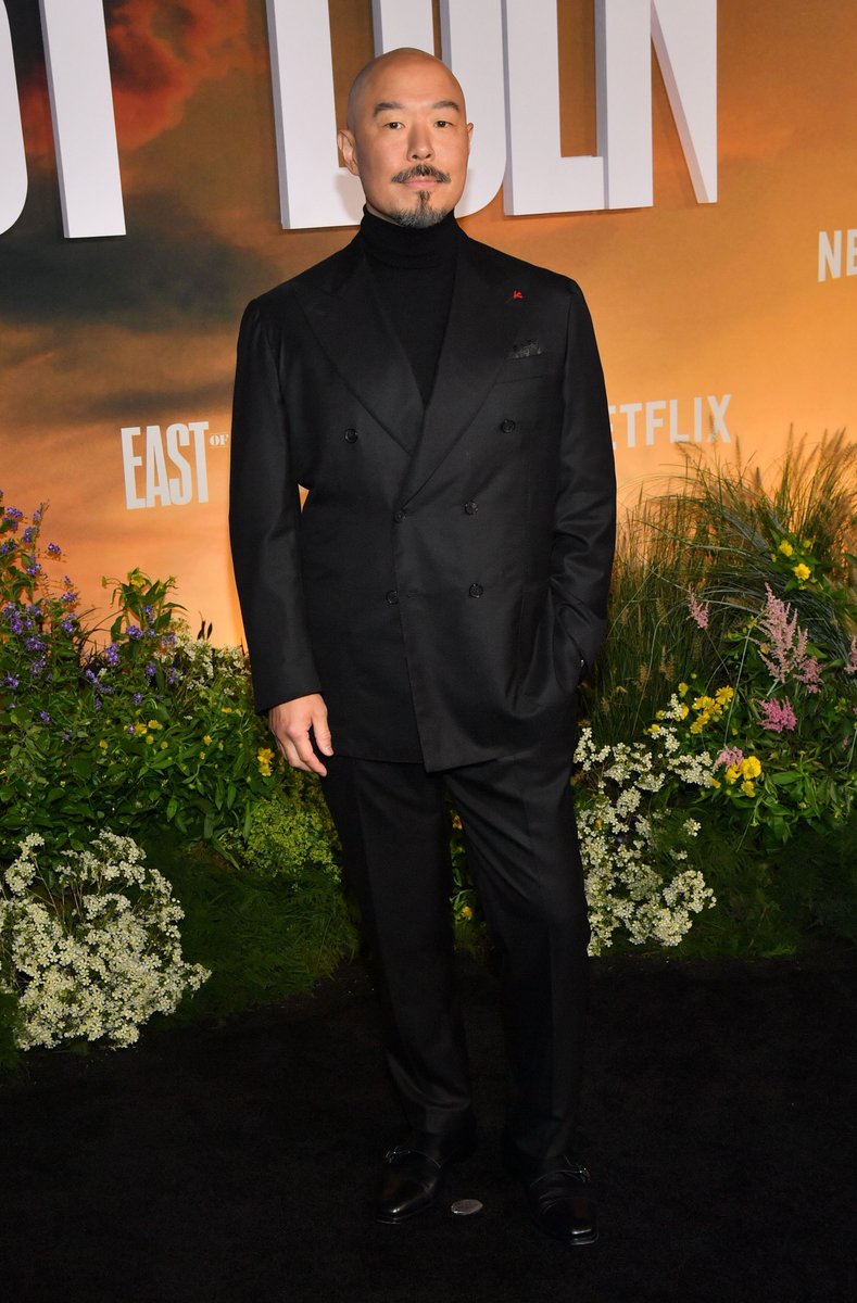 celeb124's tweet photo. Hoon Lee hit the East of Eden premiere at The Plaza Hotel in New York City in a black double-breasted suit over a black turtleneck with a red lapel pin. Polished black monk-strap shoes finished the Netflix carpet look. https://t.co/9frcsE8rrj