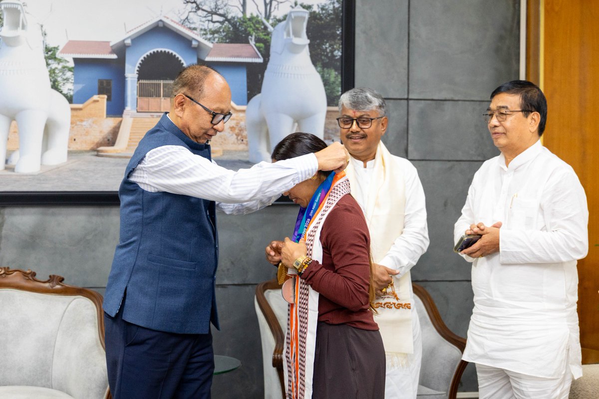 YKhemchandSingh's tweet photo. Met India's star weightlifter, Km. Saikhom Mirabai Chanu, who won a silver medal in the women's 48 kg category and elite Indian Wushu Sanda fighter, Km. Naorem Roshibina Devi, who won a silver medal in the women's Sanda 60 kg category at the Aichi-Nagoya Asian Games 2026 in Japan, at my Secretariat, Mantripukhri, today. 

Mirabai lifted 87 kg in snatch and 111 kg in clean and jerk, with a total lift of 198 kg, to clinch the silver medal. Roshibina has created history by winning medals at three consecutive Asian Games, bronze in 2018, silver in 2023 and 2026, becoming the first Indian woman to achieve this feat in Wushu.

I extend my heartiest congratulations to both players for once again making the entire country and the State proud. Their hard work, discipline and perseverance continue to be an inspiration for all young sportspersons in the country, especially the youth of Manipur.

The State Government will continue to extend all possible support to sportspersons to promote sports in the State and I wish them continued success in the future.
