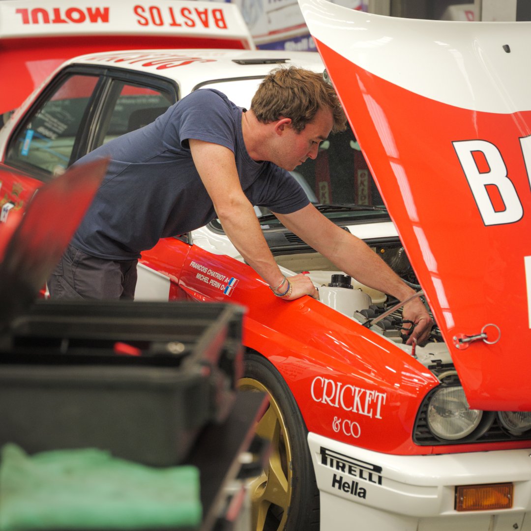 prodrive's tweet photo. Forty years after the launch of the BMW M3, our Group A  from our Heritage Collection is being prepared in the workshop ahead of this weekend's Scramble at @BicesterH.

The car will join @BMW UK's 40th anniversary celebration of one of a true icon.

#wearescramblers 
#BMWUK #MPower #40yearsM3 #PerformanceUnlimited #ProdriveLegends