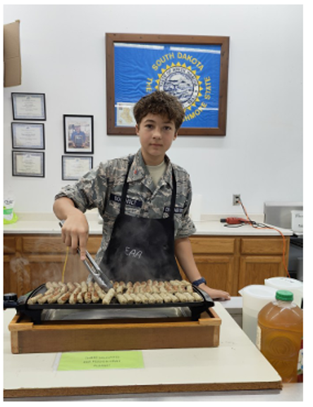 SDWingCAP's tweet photo. Our Lincoln County Squadron holds its meetings at the county EAA building. The squadron gives back by volunteering at EAA events.

Here, a CAP cadet cooks for the monthly EAA pancake breakfast. It's a way cadets learn the value of service and responsibility.

#CivilAirPatrol https://t.co/9eGEUGwRdI