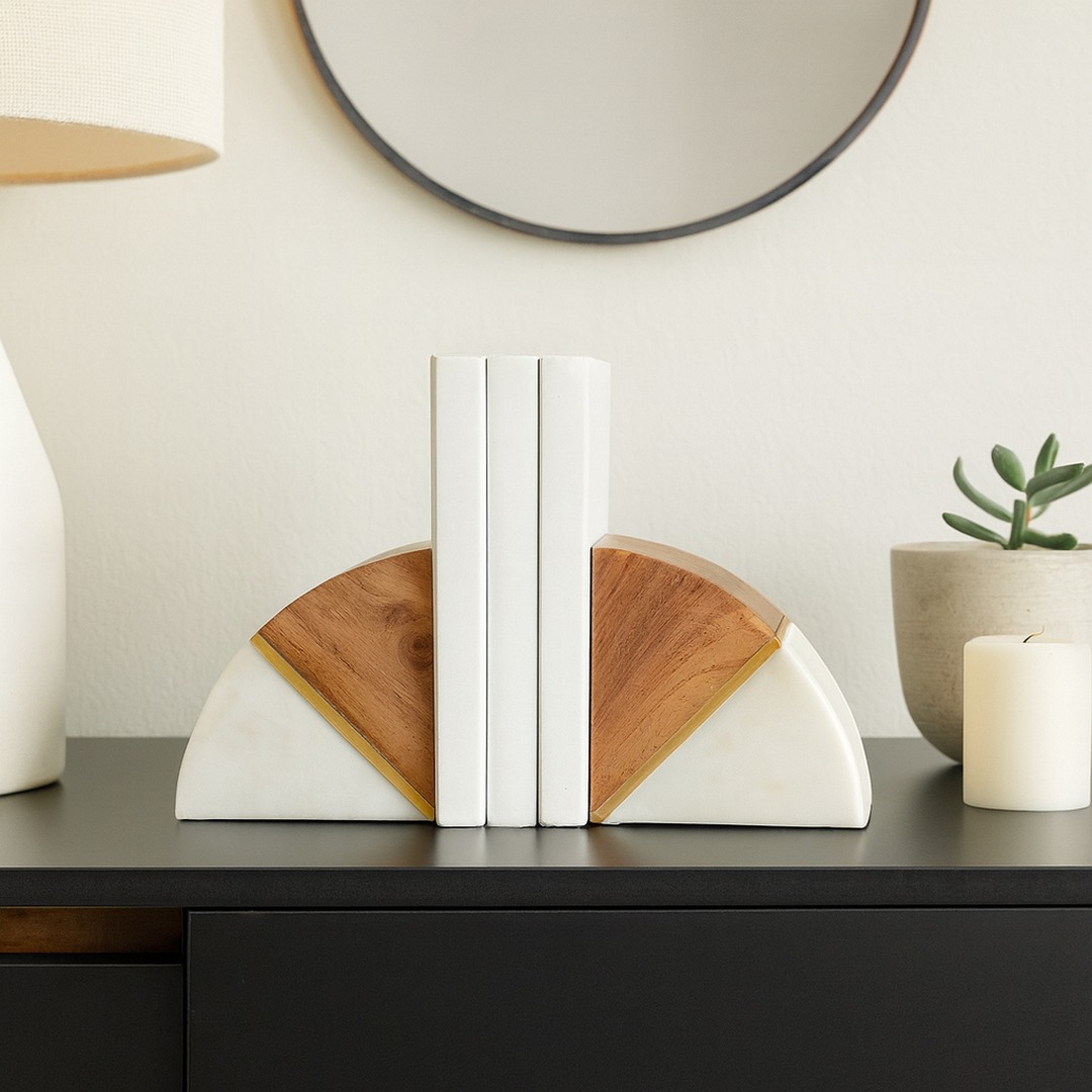danieljdevries's tweet photo. Everything is digital, but people still like frames and bookends on their shelves and tables.

Today's Sagebrook Home frames and bookends make the case for physical. The 5x7 gold In Bloom frame brings butterfly sculpture to a shelf, the 4x6 Petals frame carries blue and white florals, and two sets of marble bookends, one with white orbs and one with wood and brass, give a row of books something worth leaning on.

Phones hold the photos and tablets hold the books, yet shelves and tables still call for something real, and frames and bookends remain a strong business for us. We are providing site-ready photography with each piece, so it can go live quickly on your ecommerce site and social, and show up across online search, omnichannel, and AI-driven discovery. The picture makes the first sale.

#WholesaleDecor #SagebrookHome