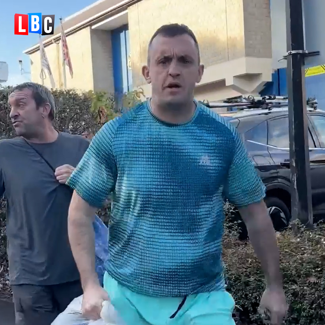 An LBC reporter interviews a muscular man in a teal shirt outside a building, with another man walking behind him. The image accompanies a post criticizing the early release of inmates to free up prison space, with the interviewee reportedly smirking and "thanking" the Prime Minister before stating his support for Labour.