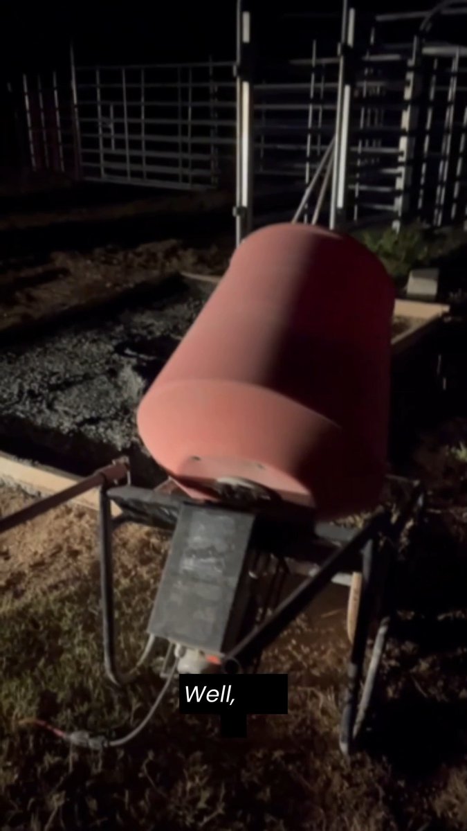 A pink cement mixer at a construction site at night, with the caption 'Well,'