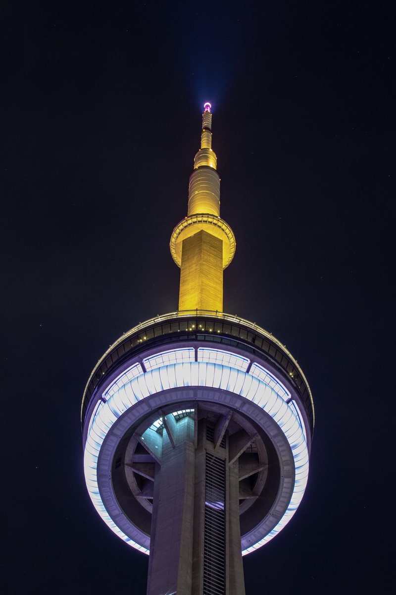 TourCNTower's tweet photo. Tonight the #CNTower will be lit yellow, white and black for The Tyler Effect –to raise awareness for victims of crime and to end gun violence https://t.co/MvSlCTuvS1