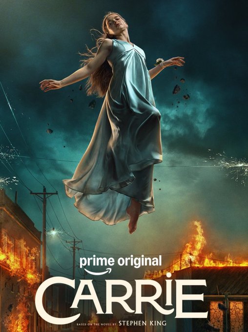 A promotional poster for "Carrie," a Prime Original based on Stephen King's novel, showing a barefoot young woman in a flowing pale dress floating ominously above a fiery, chaotic street scene. The image aligns with the post by highlighting the title, platform ("prime original"), and source material ("Based on the novel by Stephen King") for Mike Flanagan's upcoming October 7 Prime Video premiere.