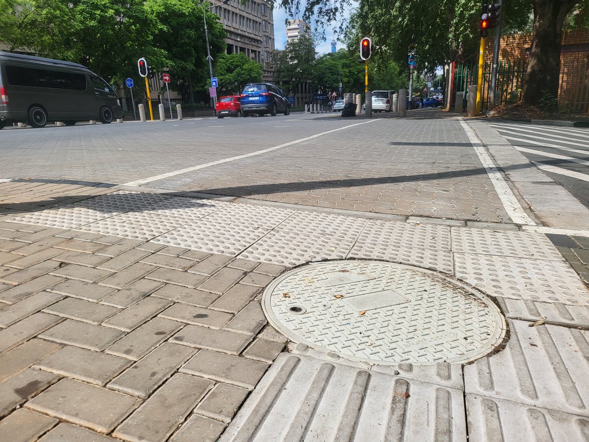 MyJRA's tweet photo. @CityofJoburgZA @RegionF_Joburg @Kenny_T_Kunene @CoJTransport @ReaVayaBus @_ArriveAlive @JoburgMPD @CityPowerJhb [Protecting city infrastructure] @MyJRA has installed underground controller box chambers in Braamfontein to safeguard traffic signal equipment against theft and vandalism while keeping pedestrian walkways clear and safe. 
@CityofJoburgZA #OTM2026 #JoburgRoads https://t.co/AebrUCis1T