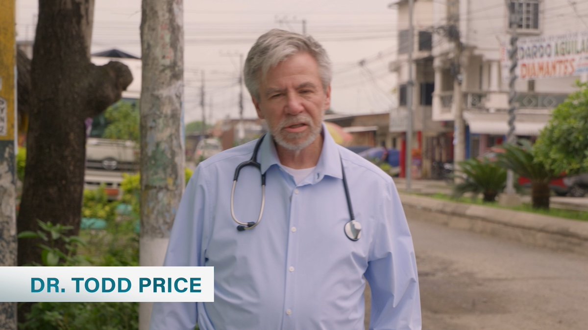 Dr. Todd Price, identified by an on-screen lower-third graphic, stands on a street in Mariscal Sucre, Ecuador, wearing a light blue shirt with a stethoscope around his neck, illustrating the medical mission work described in the post.