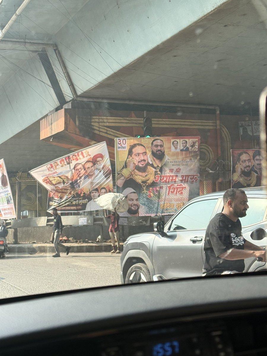 INDIANSBLOOD's tweet photo. @mybmcWardME @mybmc Why is there an illegal hoarding installed at Shivaji Nagar Signal unnecessarily occupying public space? This is causing obstruction and should not be allowed. Requesting you to inspect the location and take immediate action to remove the illegal hoarding. https://t.co/70ByM6Sack