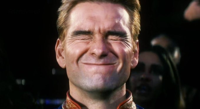 The image shows a CGI-rendered man with blonde hair making an exaggerated, strained smile, with his eyes closed tight—characteristic of the uncanny "weird smile" meme often associated with the character Greg Universe or similar internet memes. The forced, pained grin humorously contrasts with the inspirational caption "Everyone has the right to dream," as the smile appears anything but dreamy or joyful, suggesting a sarcastic or ironic take on the quote.