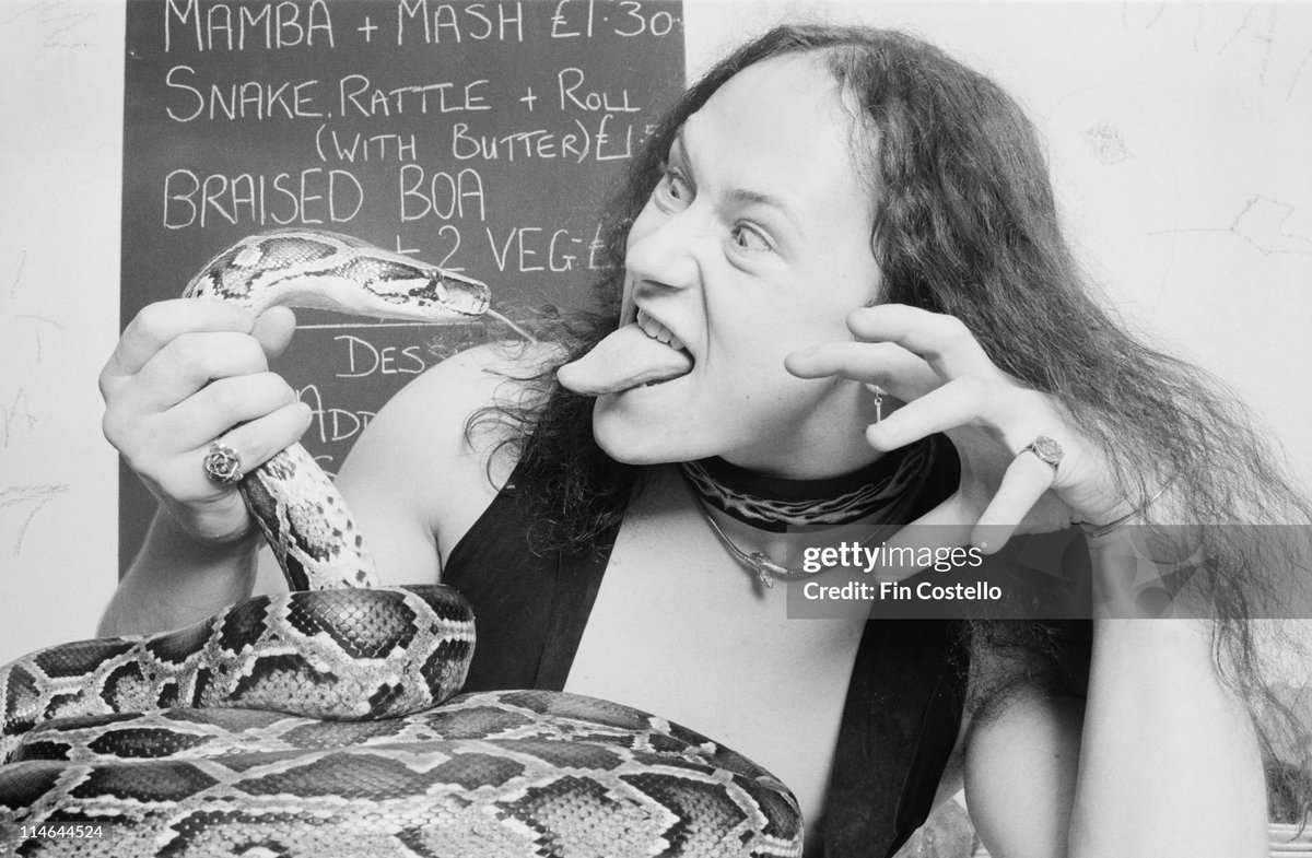shitbritishpics's tweet photo. Conrad 'Cronos' Lant from Heavy Metal band Venom posed with snakes on a cafe table in London (1985) https://t.co/IFz25txzd7