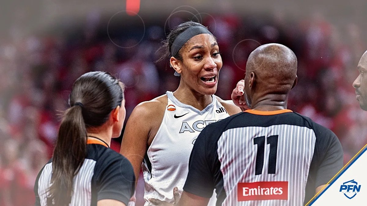 proamericapol's tweet photo. 🚨REPORT: WNBA officials are claiming A'Ja Wilson was not ejected and won't be suspended because she was in the "player escape lane" and not the stands.

This is a lie. 

She walked about 20 feet up to the second row of the stands and got in a fan's face.

They are making up excuses in order to not enforce their own code of conduct.