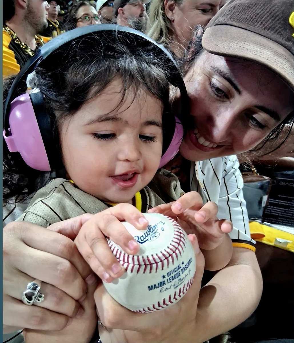 bernsrose's tweet photo. Want to give a shoutout to 2 Petco Park employees last night who gifted Dakota some special souvenirs and made her so happy: one of the 50/50 raffle guys gave her a pack of baseball cards and one of the security guards in our area brought over a game ball for her 💛 thank you!!! https://t.co/xtFuBmJUKc