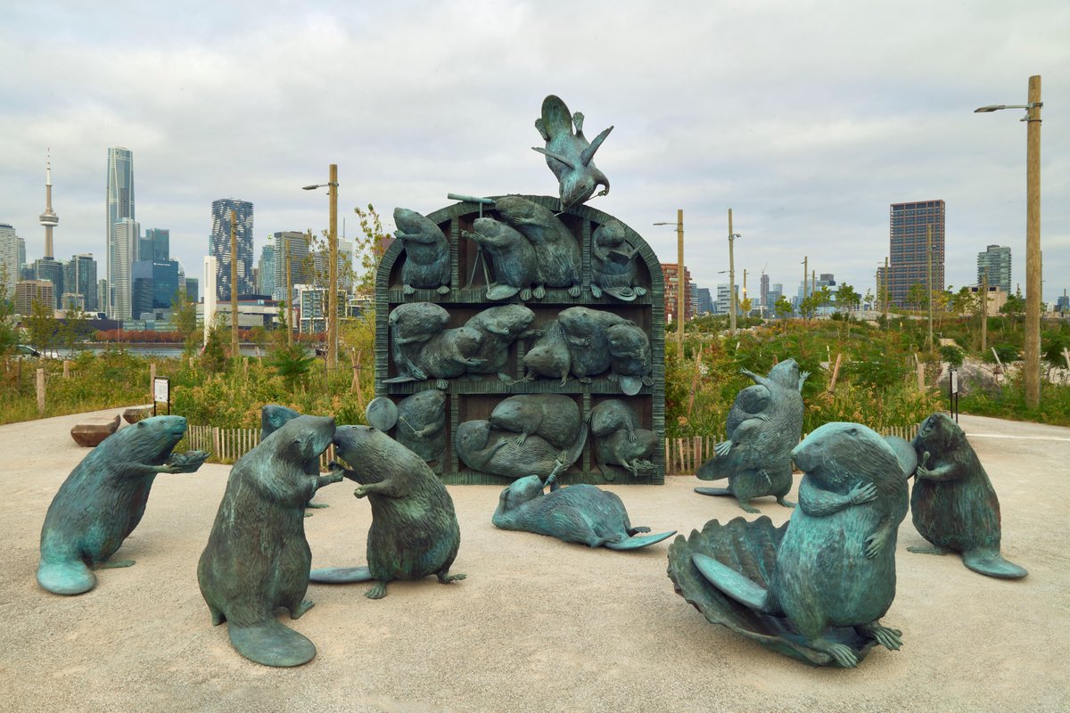 WaterfrontTO's tweet photo. A restored river valley deserves its most famous engineers.  
  
This week, the Lassonde Art Trail culminatesits launch season with the unveiling of The Colony (2026) by acclaimed Cree artist Kent Monkman at Biidaasige Park. The Colony is a playful reminder of the animals that have helped shape ecosystems across Turtle Island. 
  
 Through the Port Lands Flood Protection project, made possible by a $1.4 billion investment from the Government of Canada, the Province of Ontario (@ONgov), and the City of Toronto (@cityoftoronto), former industrial lands have been transformed into a new river valley, thriving habitat, and world-class public spaces.  
 
The Colony builds on that vision, demonstrating how art can enrich public spaces while creating new opportunities for people to connect with nature, water, and the histories that have shaped this place for generations.