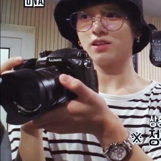 ggukhee's tweet photo. bucket hat on, camera in hand… the boy he’s always been ☹️ https://t.co/DAuBHVUAdV