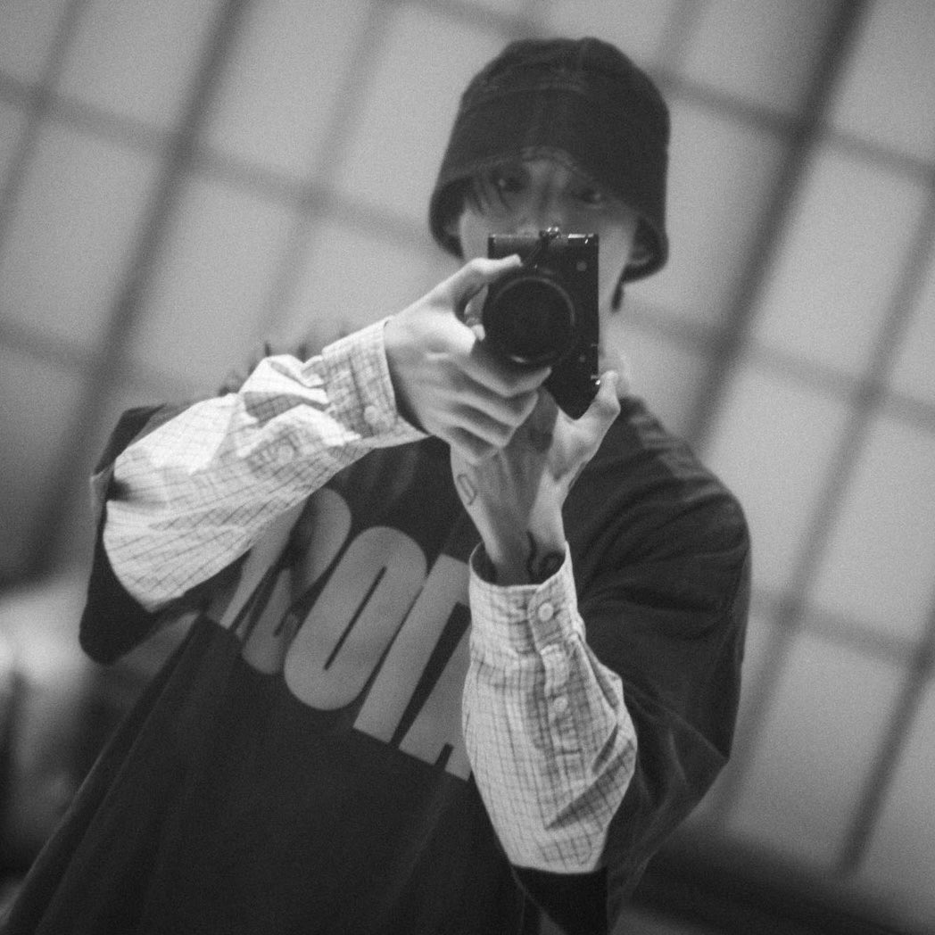 ggukhee's tweet photo. bucket hat on, camera in hand… the boy he’s always been ☹️ https://t.co/DAuBHVUAdV