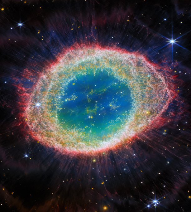 konstructivizm's tweet photo. An infrared portrait of the Ring Nebula (M57) from the James Webb Telescope! 💫

It is estimated to be 4,000 years old and lies just over 2,000 light-years from Earth in the constellation Lyra. It represents the final stage in the life of a star similar to the Sun, though more massive. It features a complex structure of expanding gas shells shed by the dying star, with a white dwarf at its center.