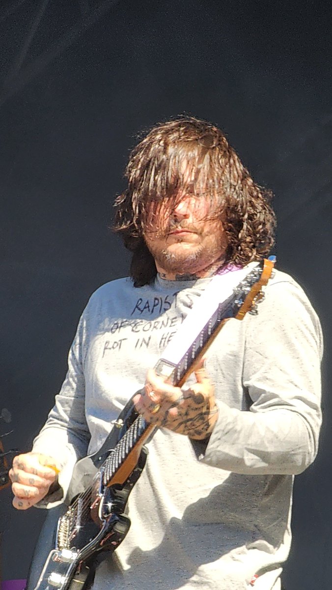 SOTSPodcast's tweet photo. Frank Iero wears shirt reading "Rapists of Cornell Rot In Hell" during L.S. Dunes performance at Aftershock.

📷 @wr0aig https://t.co/seMYkK4KCs