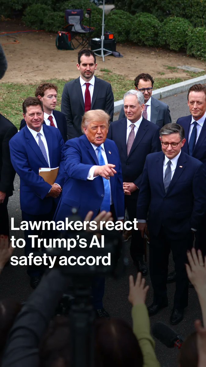 President Trump is surrounded by tech executives and lawmakers at a White House event, as the headline reads "Lawmakers react to Trump's AI safety accord." The image shows him speaking to the press with several men in suits standing nearby, illustrating the gathering of top tech executives mentioned in the post about the voluntary AI safety pledge that has divided Capitol Hill over self-policing versus federal oversight.