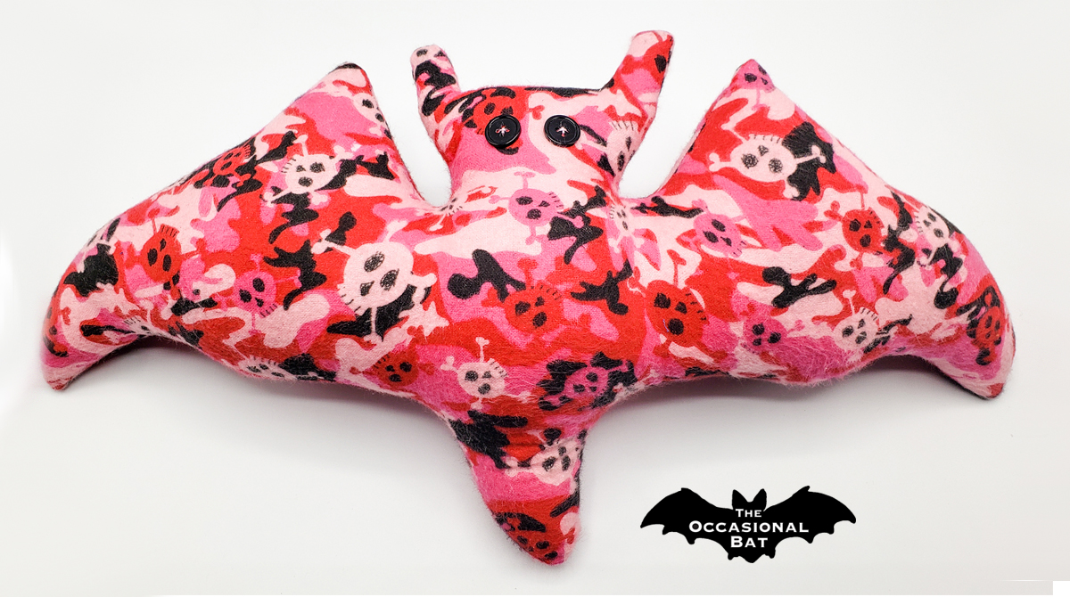 OccasionalBat's tweet photo. Embrace your spooky style with our fabulous pink and black skulls! 💀 Perfect for adding a fun twist! 💓 #TheOccasionalBat #Handmade #BatShapedPillow #CodeOrange https://t.co/XPJnrHLRUu https://t.co/HvLnmgVorv