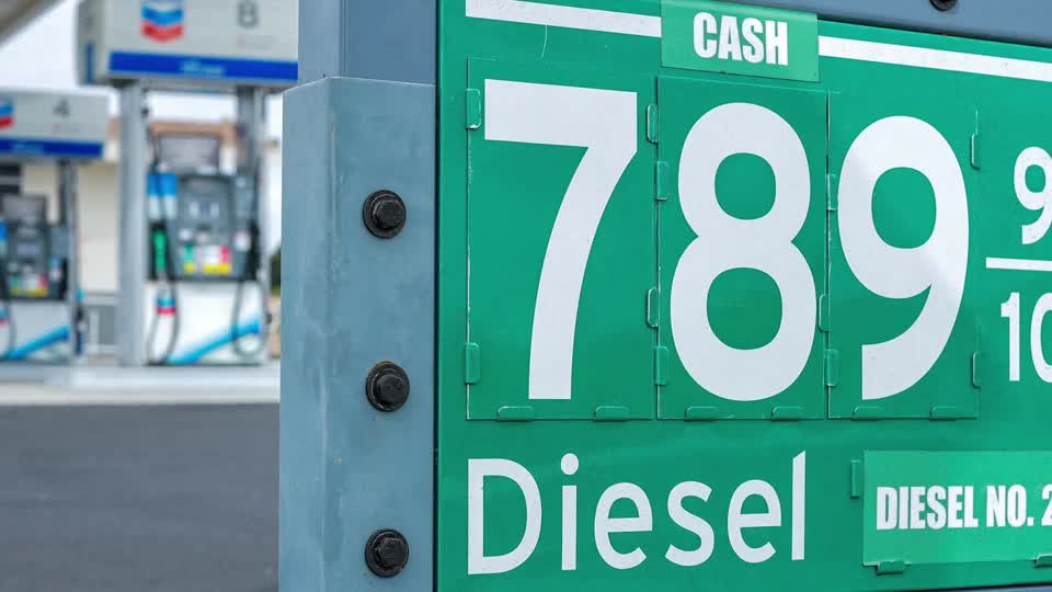 A close-up of a gas station sign displays diesel fuel prices at $7.89⁹/₁₀ per gallon, reflecting the record-high diesel prices that are driving up costs for food, deliveries, and other goods while adding to inflationary pressures.