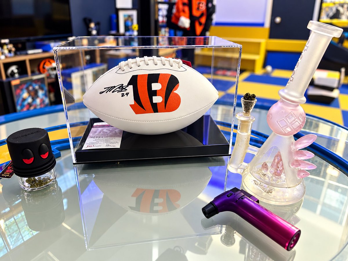 BlairBrookfield's tweet photo. Chill evening with my love…he got me a case for my Joe Mixon signed football! Time to start working on my #Bengals section in his man cave! 
#420 #bong #CincinnatiBengals
#mancave https://t.co/ICFi3hbbbr