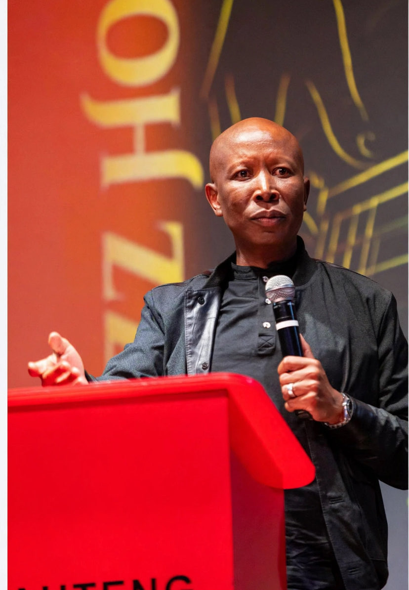 Mzansiawake's tweet photo. Hating Malema is a Currency 📮

They don't debate Malema, they manufacture hate against him.

For years now, if you pay attention, you will notice a pattern. Thousands of accounts, all with African names, all speaking like "concerned black people" — but their only job is to attack the one man who refuses to stop talking about land, dignity, and economic freedom for Africans.

They hide behind our names. They use our languages. They pretend to be us, so that when they insult Malema, it looks like it's black people rejecting their own son.

It is not. It is a digital blackface. It is white supremacy wearing a mask, because they know they can no longer attack us openly in South Africa — so they create fake blacks to do it for them.~@Mzanziawake ~Speaks