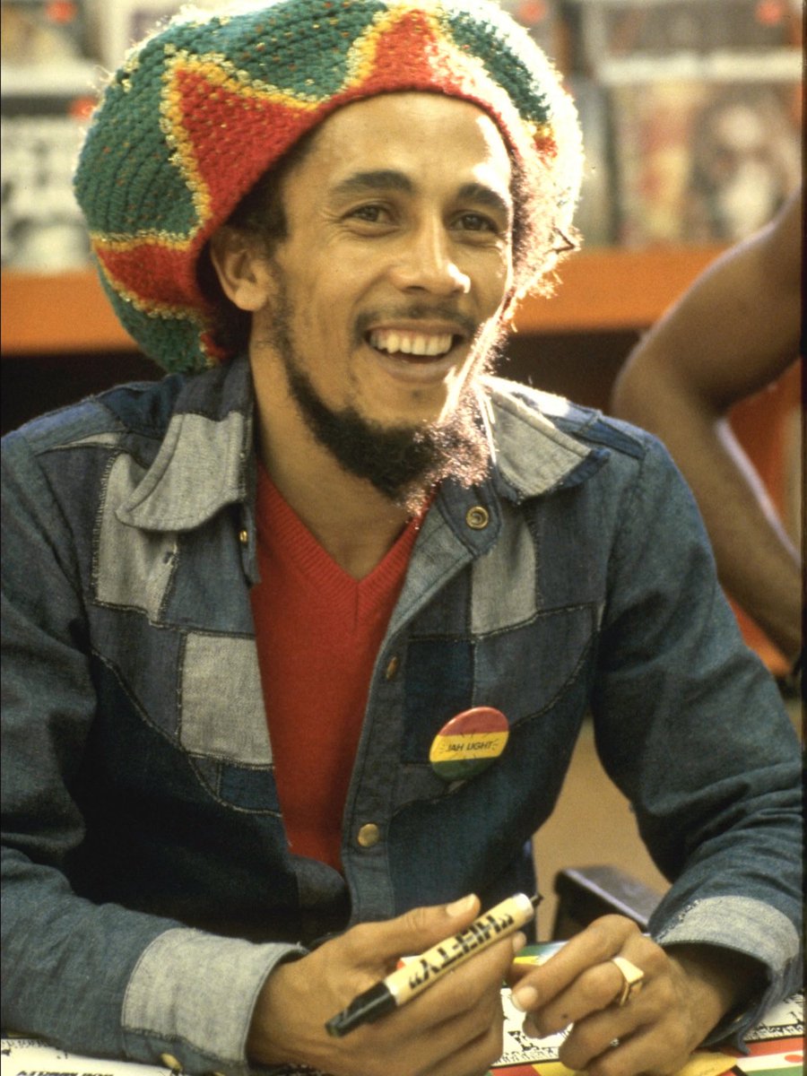 CloutedWear's tweet photo. Bob Marley signing copies of "Survival" at Tower Records in West Hollywood, photographed by Chris Walter (1979) https://t.co/o90n7Haojw