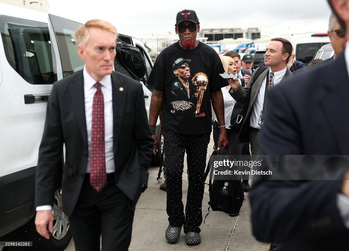PollTracker2024's tweet photo. Getty Images: Former NBA player Dennis Rodman walks with Senator James Lankford (R-OK) at a Trump rally in Denton, Texas https://t.co/W7qH0yQuPx