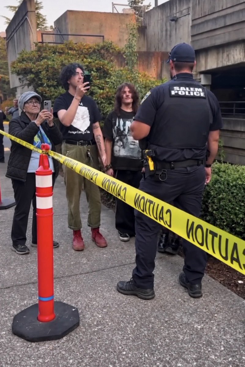 RheinAmacher's tweet photo. What a surprise—the former January 6 insurrectionist, @PamHemphill79, is now leading her tranny-cult-like followers to berate and harass law-enforcement officers who are simply trying to do their jobs! https://t.co/Zhdh9IxLnS