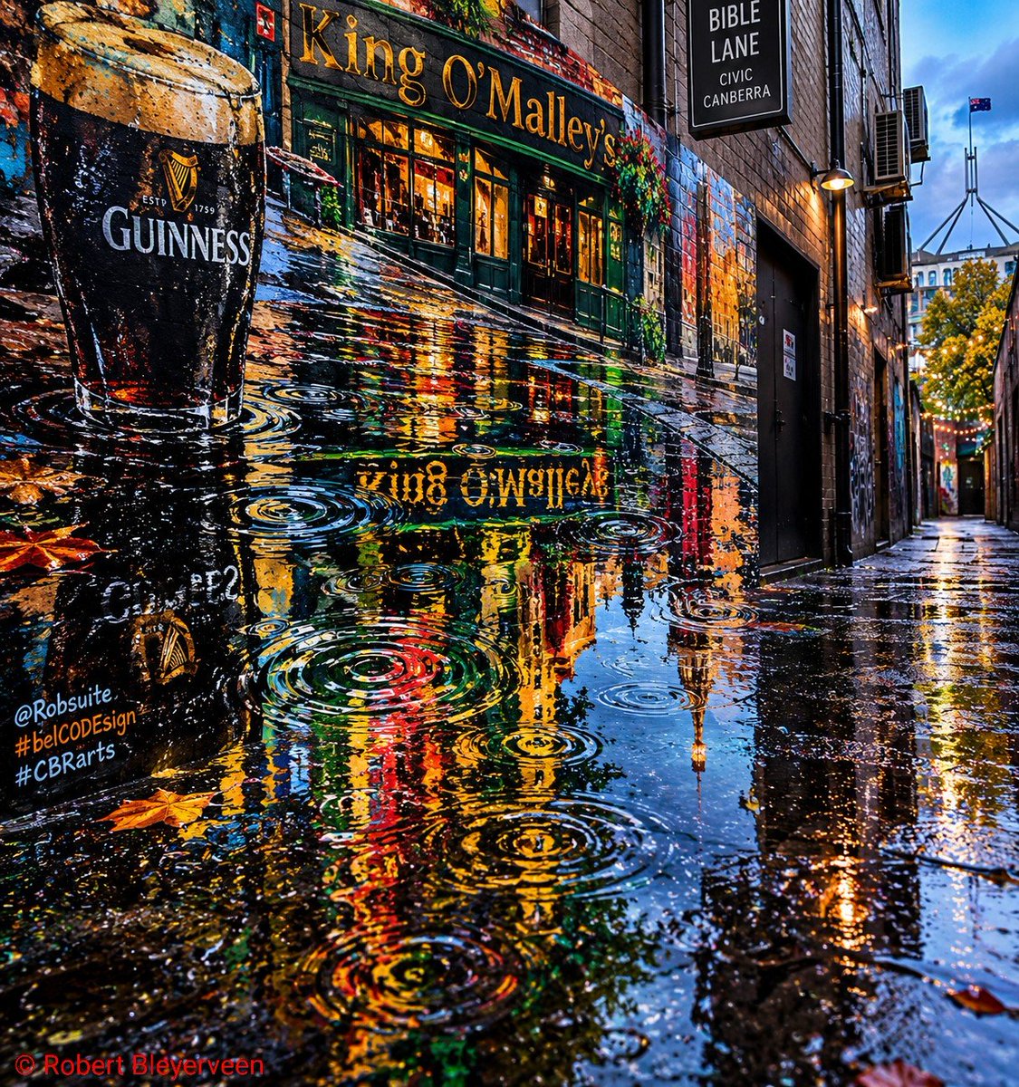 Robsuite's tweet photo. SPILLED

Just off City Walk Civic, where the pavement meets art,

is a flood of fresh street culture and a pub with a heart. 🍀 💚 

🖋️ Robert Bleyerveen 

Artwork: SPILLED 
Artist: Robert Bleyerveen 
©️ 2026 Robert Bleyerveen 

#streetart #CBRarts #belCODEsign #canberra https://t.co/SaqGJTPoih