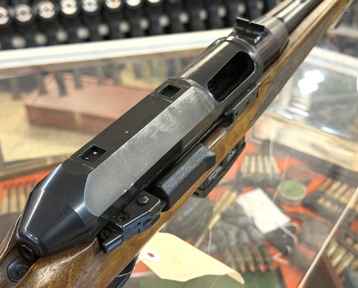Owen_Guns's tweet photo. Welcome back to Firearm Friday! This week we’ve got something that looks more at home in a traditional hunting cabinet than an H&K catalogue, but underneath that timber is Heckler & Koch engineering. Meet the HK 630.
When most people hear the name Heckler & Koch, their mind probably jumps straight to firearms such as the G3, HK91 or MP5. The HK 630 is a rather different looking member of the family. With its traditional timber sporting stock and relatively understated appearance, you could easily walk past one without realising that internally it shares some very interesting engineering with H&K's better-known military designs.
The Heckler & Koch HK 630 was a German-made semi-automatic sporting rifle chambered in .223 Remington/5.56×45mm. It belonged to a family of sporting rifles produced by H&K that included larger-calibre models such as the HK 770 and HK 940. What makes these rifles particularly interesting today is H&K's decision to adapt its famous roller-delayed blowback operating system to a rifle intended primarily for the sporting and hunting market.
Rather than using the gas-operated action found in many conventional semi-automatic hunting rifles, the 630 employs the same general roller-delayed principle for which H&K became famous. Closely related systems appeared in firearms including the G3 and MP5. The chamber was also fluted to assist extraction, another characteristic strongly associated with H&K's roller-delayed firearms.
Where the HK 630 differs dramatically is in presentation. H&K wrapped all that German engineering in a much more conventional sporting package. The rifle features a full wooden sporting stock, longer sporting-profile barrel and conventional sights rather than trying to resemble one of the company's military rifles.
One unusual feature is the charging handle. Instead of the familiar forward-mounted handle seen on firearms such as the G3 and MP5, the 630's handle is positioned toward the rear of the receiver on the right-hand side. The rifle feeds from proprietary detachable magazines rather than the magazines used by H&K's military rifles.
The 630 is particularly important when looking at the history of another unusual H&K, the SL6. The relationship actually runs the opposite way to what can sometimes be assumed: the HK 630 came first, and the SL6 was subsequently developed from the same sporting-rifle design. The SL6 essentially pushed the concept in a more military-influenced direction, using a shorter barrel, wooden fore-end and H&K-style diopter sights while retaining the basic roller-delayed system. Sources describing the SL6 specifically identify the 630-family sporting rifle as its predecessor.
The family never became as commercially successful as H&K's military designs. They were comparatively expensive rifles to manufacture and buy, and production numbers were limited. Surviving examples have consequently become interesting collector pieces, particularly for enthusiasts wanting something from the stranger corners of H&K's catalogue. Reported factory date codes indicate HK 630 examples from the 1980s, although precise production ranges quoted by collectors vary.
The later SL6 and SL7 continued the idea, combining sporting timber furniture with unmistakably H&K mechanical features. The SL6 manual, for example, specifies a polygonal barrel and H&K's roller system, illustrating just how much of the company's established engineering made its way into these unusual sporting rifles.
Today, the HK 630 represents a fascinating period in Heckler & Koch history. It doesn't have the instantly recognisable silhouette of an MP5 or G3, and that's precisely what makes it interesting. Underneath the polished timber and sporting-rifle appearance is a piece of classic Cold War-era German engineering, and one that helped provide the foundation for the later SL6.
So that's this week's Firearm Friday, proof that not every Heckler & Koch needs black furniture and a military pedigree to be interesting! The HK 630 might look like a gentleman's hunting rifle, but underneath the timber it's still very much an H&K.
We'll dig through the Owen Guns Museum collection and find something else interesting for next Friday, you will never know what other treasures we will find!
