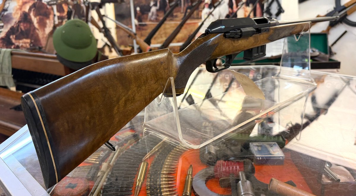 Owen_Guns's tweet photo. Welcome back to Firearm Friday! This week we’ve got something that looks more at home in a traditional hunting cabinet than an H&K catalogue, but underneath that timber is Heckler & Koch engineering. Meet the HK 630.
When most people hear the name Heckler & Koch, their mind probably jumps straight to firearms such as the G3, HK91 or MP5. The HK 630 is a rather different looking member of the family. With its traditional timber sporting stock and relatively understated appearance, you could easily walk past one without realising that internally it shares some very interesting engineering with H&K's better-known military designs.
The Heckler & Koch HK 630 was a German-made semi-automatic sporting rifle chambered in .223 Remington/5.56×45mm. It belonged to a family of sporting rifles produced by H&K that included larger-calibre models such as the HK 770 and HK 940. What makes these rifles particularly interesting today is H&K's decision to adapt its famous roller-delayed blowback operating system to a rifle intended primarily for the sporting and hunting market.
Rather than using the gas-operated action found in many conventional semi-automatic hunting rifles, the 630 employs the same general roller-delayed principle for which H&K became famous. Closely related systems appeared in firearms including the G3 and MP5. The chamber was also fluted to assist extraction, another characteristic strongly associated with H&K's roller-delayed firearms.
Where the HK 630 differs dramatically is in presentation. H&K wrapped all that German engineering in a much more conventional sporting package. The rifle features a full wooden sporting stock, longer sporting-profile barrel and conventional sights rather than trying to resemble one of the company's military rifles.
One unusual feature is the charging handle. Instead of the familiar forward-mounted handle seen on firearms such as the G3 and MP5, the 630's handle is positioned toward the rear of the receiver on the right-hand side. The rifle feeds from proprietary detachable magazines rather than the magazines used by H&K's military rifles.
The 630 is particularly important when looking at the history of another unusual H&K, the SL6. The relationship actually runs the opposite way to what can sometimes be assumed: the HK 630 came first, and the SL6 was subsequently developed from the same sporting-rifle design. The SL6 essentially pushed the concept in a more military-influenced direction, using a shorter barrel, wooden fore-end and H&K-style diopter sights while retaining the basic roller-delayed system. Sources describing the SL6 specifically identify the 630-family sporting rifle as its predecessor.
The family never became as commercially successful as H&K's military designs. They were comparatively expensive rifles to manufacture and buy, and production numbers were limited. Surviving examples have consequently become interesting collector pieces, particularly for enthusiasts wanting something from the stranger corners of H&K's catalogue. Reported factory date codes indicate HK 630 examples from the 1980s, although precise production ranges quoted by collectors vary.
The later SL6 and SL7 continued the idea, combining sporting timber furniture with unmistakably H&K mechanical features. The SL6 manual, for example, specifies a polygonal barrel and H&K's roller system, illustrating just how much of the company's established engineering made its way into these unusual sporting rifles.
Today, the HK 630 represents a fascinating period in Heckler & Koch history. It doesn't have the instantly recognisable silhouette of an MP5 or G3, and that's precisely what makes it interesting. Underneath the polished timber and sporting-rifle appearance is a piece of classic Cold War-era German engineering, and one that helped provide the foundation for the later SL6.
So that's this week's Firearm Friday, proof that not every Heckler & Koch needs black furniture and a military pedigree to be interesting! The HK 630 might look like a gentleman's hunting rifle, but underneath the timber it's still very much an H&K.
We'll dig through the Owen Guns Museum collection and find something else interesting for next Friday, you will never know what other treasures we will find!