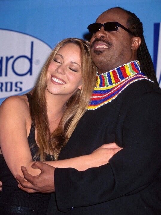 CloutedWear's tweet photo. Mariah Carey and Stevie Wonder backstage at the 1998 Billboard Music Awards https://t.co/EOAWtbwqpO