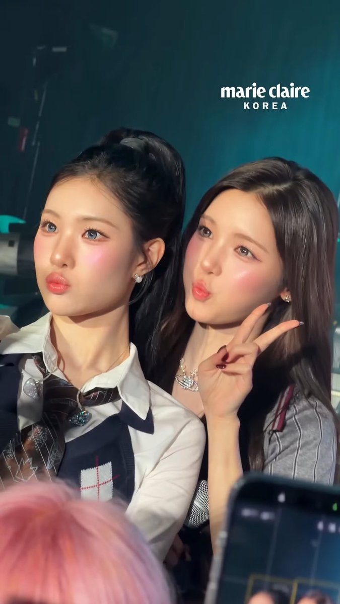 Two women with heavily blushing, bright pink cheeks posing together at what appears to be a photo event, with "marie claire KOREA" text in the upper right.
