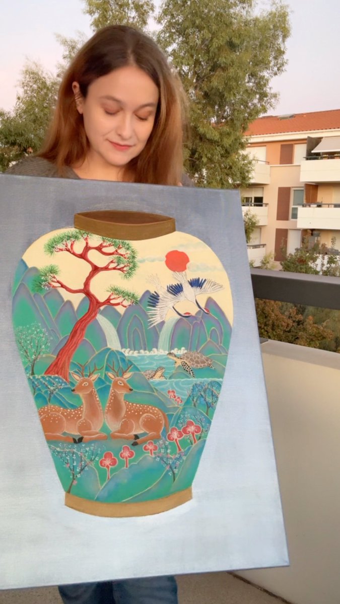 A young woman proudly displays her artwork featuring Korea's Ten Symbols of Longevity—deer, sun, crane, pine tree, mountains, water, and mushrooms—unified within the shape of a traditional moon jar.