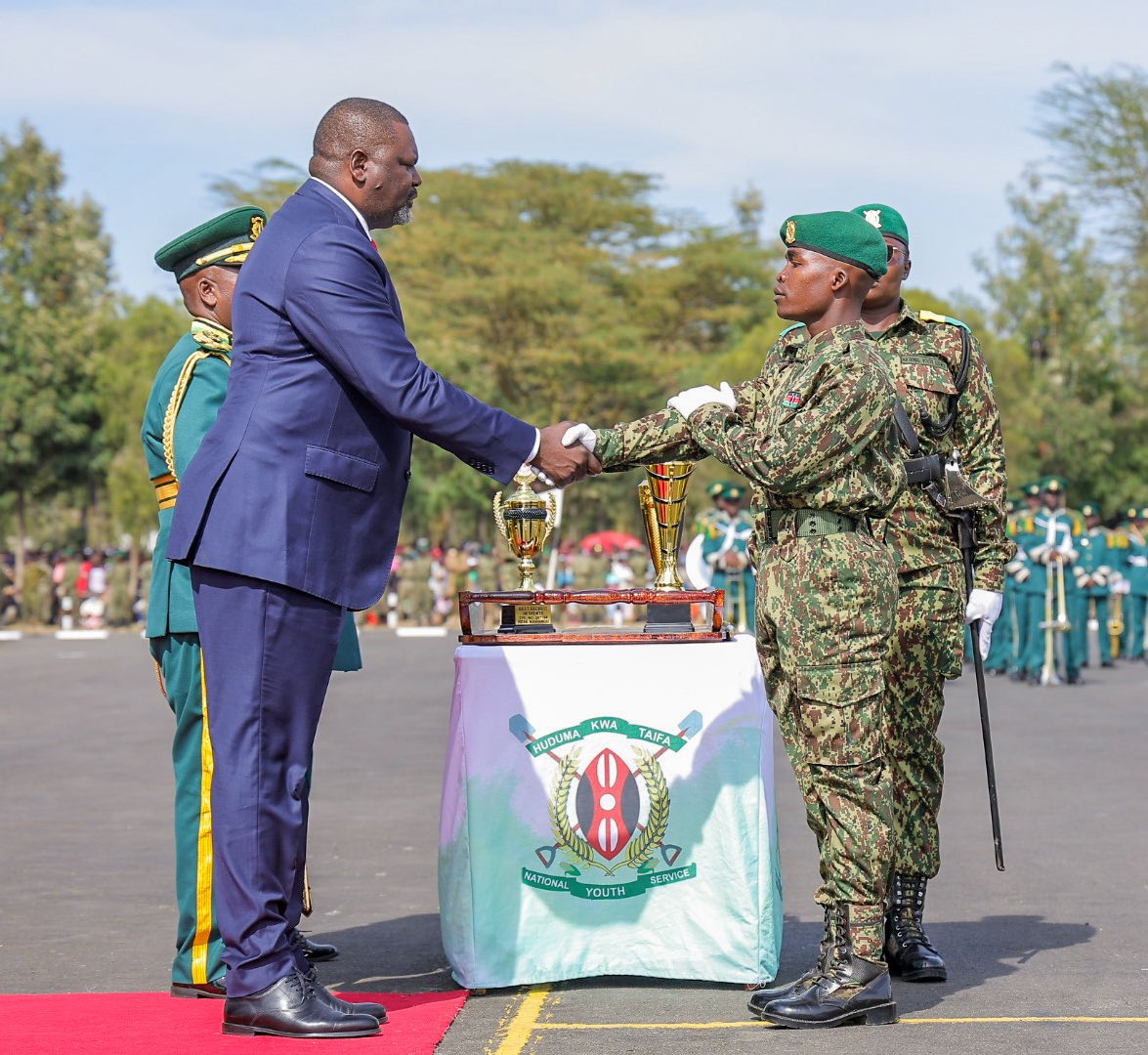 PoliceKE's tweet photo. "Today is not simply a graduation ceremony. It is a celebration of discipline, patriotism, resilience, skills development, and service to the Republic of Kenya."
Cabinet Secretary for Ministry of Public Service, Performance, and Special Programmes, Hon. Geoffrey Ruku, during the National Youth Service Passing-Out Parade.
The ceremony marked the successful completion of six months of initial training for over 15,000 recruits in Gilgil, Nakuru County.