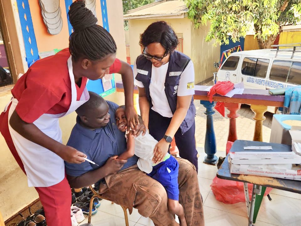 WHOUganda's tweet photo. It is Day 2 of #Uganda’s nationwide Measles-Rubella Vaccination Campaign.

@WHO teams are standing shoulder to shoulder with health workers, district leaders and communities across the country.

From vaccination posts to district coordination centers, our technical experts are supporting implementation, monitoring progress and helping ensure that every eligible child is reached with this life-saving vaccine.

Together with the @MinofHealthUG and partners, we are working towards one goal: no child missed, no community left behind.
#VaccinesWork #MeaslesRubellaCampaign
#MRCampaignUG26