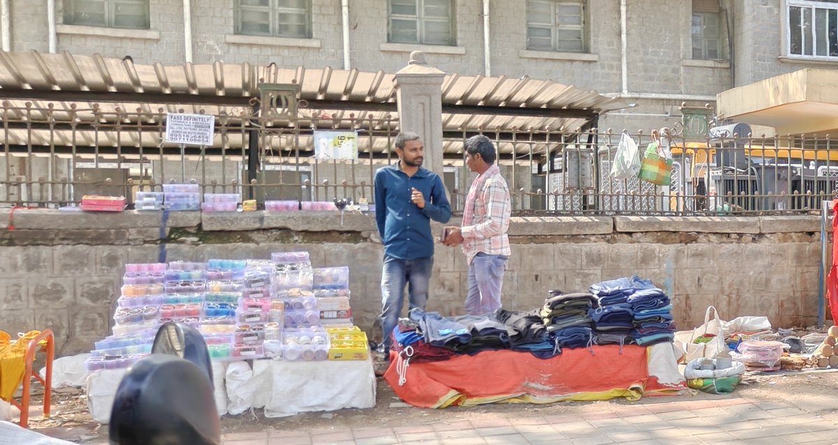 KiranKS's tweet photo. A few weeks ago, we were praising Karnataka Minister Krishna Byre Gowda for cleaning up footpaths in Bengaluru, clearing vendors. 

Today, I visited the KR Market area. The footpath vendors are back. Everywhere. 

So the praising didn't age well. Encroachment is fully back. https://t.co/xoqJF2Fa1i