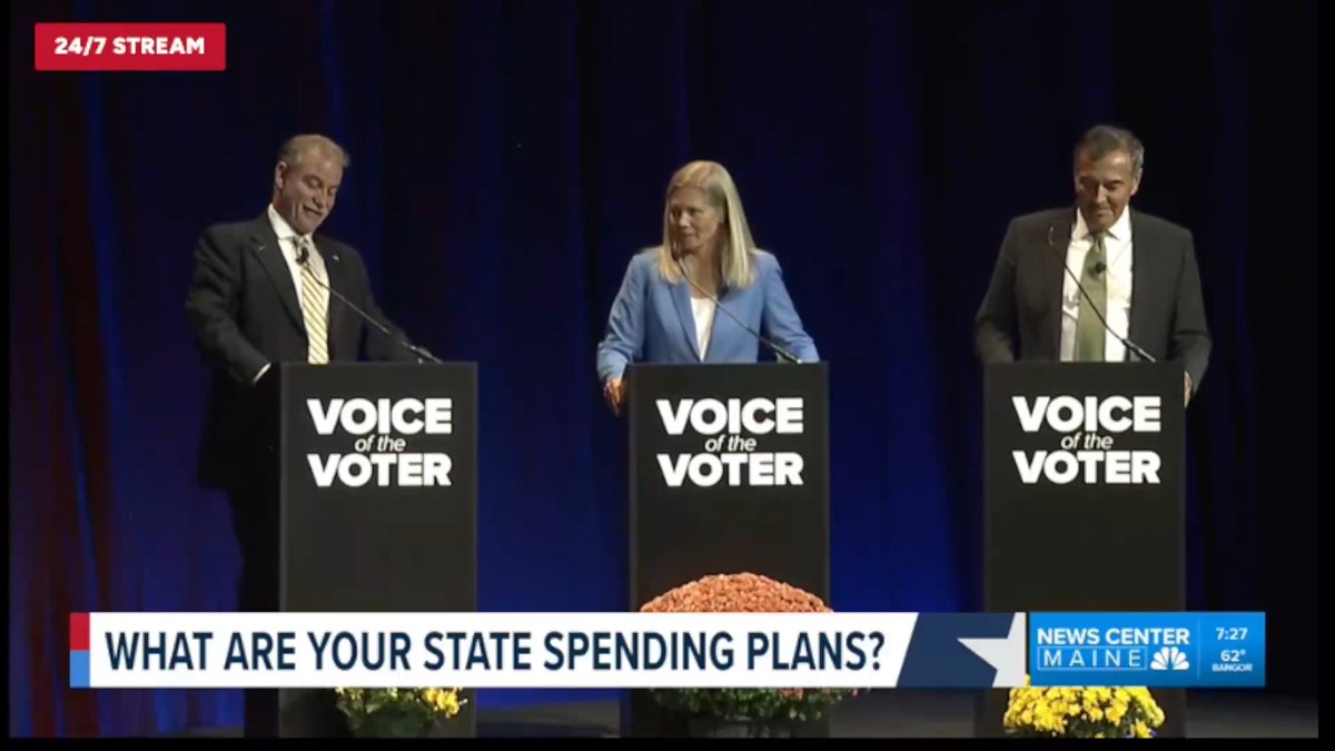 A '24/7 STREAM' news broadcast showing three candidates at podiums during a 'VOICE of the VOTER' debate, with the chyron 'WHAT ARE YOUR STATE SPENDING PLANS?' and 'NEWS CENTER MAINE' branding showing 7:27 and 62°.
