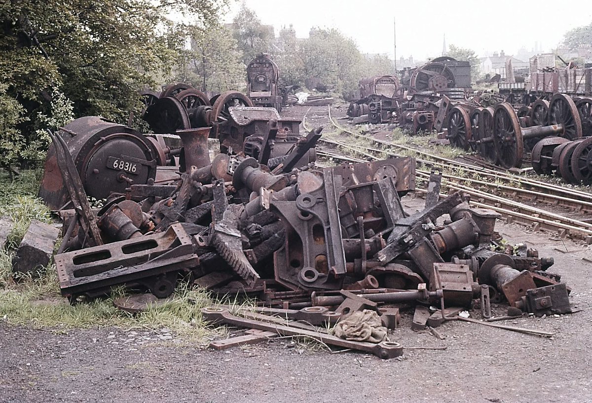 adipullenLNER's tweet photo. Darlington scrap lines c.1961. Worsdell J71 68316 has just bitten the dust and the smokebox looks like it is staring at the pile in utter disbelief. Photo: Unknown. https://t.co/y4fHservJX