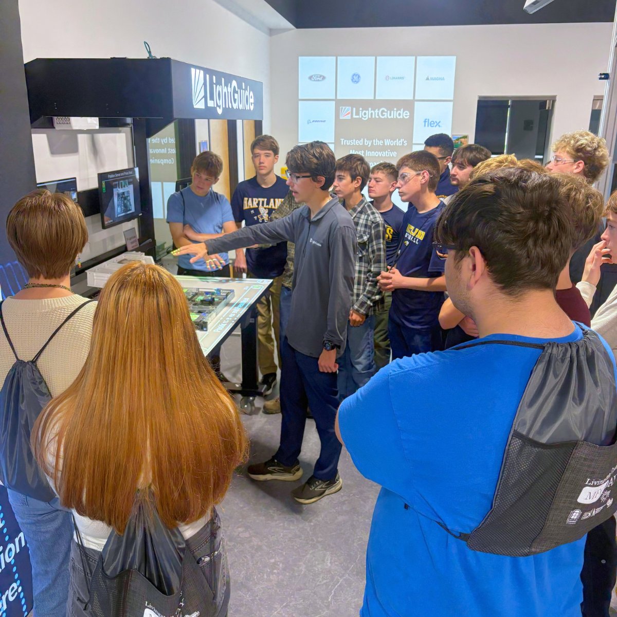 LightGuideInc's tweet photo. The future of manufacturing starts with today's students. In celebration of @MFGDay, local Career &amp; Technical Education students visited our Innovation Center for hands-on experience with augmented intelligence and other technologies transforming factory floors. #MFGDay26 https://t.co/tcyEFbxW28