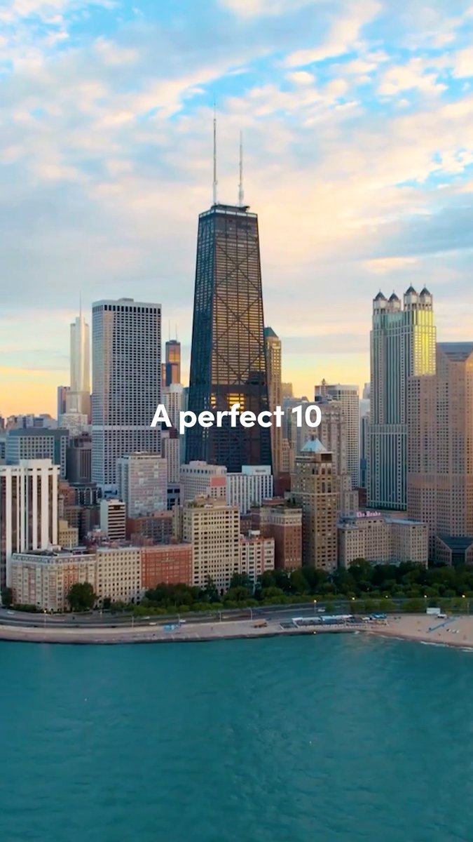 A scenic aerial view of the Chicago skyline featuring the John Hancock Center, with text overlay reading 'A perfect 10' against a sunset sky and Lake Michigan in the foreground.