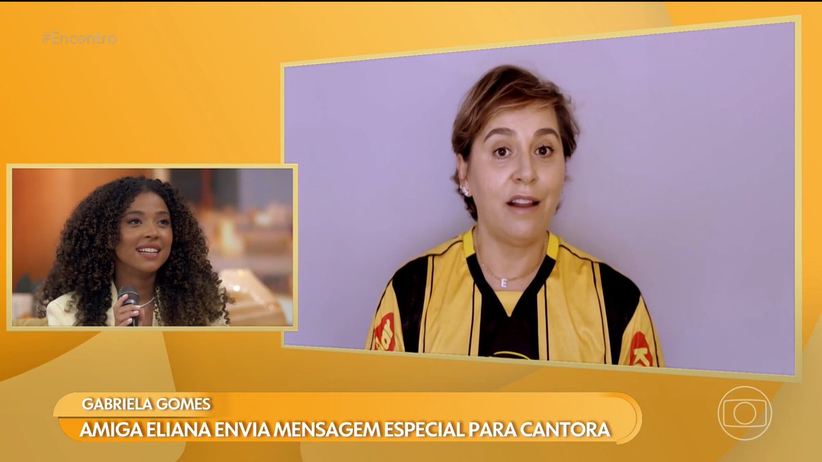 A TV news segment features a woman with curly hair, with on-screen text reading 'GABRIELA GOMES - AMIGA ELIANA ENVIA MENSAGEM ESPECIAL PARA CANTORA' and the #Encontro hashtag.