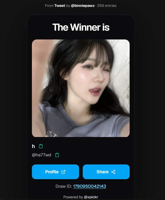 A winner announcement screen from a tweet by @binniepawz showing a selfie of a young woman with dark hair, with buttons for Profile and Share.
