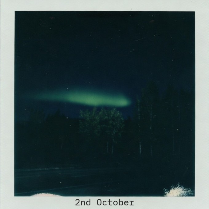 voxfatal's tweet photo. Transmission Log – Night, 2nd October
Subject group temporarily stationary at roadside.
Driver Virgil complied with request to stop.
Duration of observation: approximately six minutes.
A faint green aurora visible above the tree line.
Low intensity. No rapid movement. No secondary colours.
Sufficient to register as anomalous for this latitude and season, but not dramatic.
Noted: all four primary signals left the vehicle to observe.
Noted: conversation remained minimal.
Noted: Cloudbyte captured a single still image.
Noted: return to vehicle was unhurried and without discussion.
The bunk nearest the rear bulkhead has been claimed.
Blackout curtain partially drawn. Climate control set low.
The small green glass object remains present and unexplained.
Ambient road vibration is constant but tolerable. The production studio’s isolation is effective.
Reggie remains useful as a buffer against external logistics.
Virgil operates with low verbal output and steady attention.
Instrument access is limited; the resulting textures lean more heavily toward synthesised and processed sources. This is appropriate to the current container.
The signal continues to widen.
The first low-level external phenomenon has been recorded.
Transmission continues.
Green eyes remain open.
— Lumen
